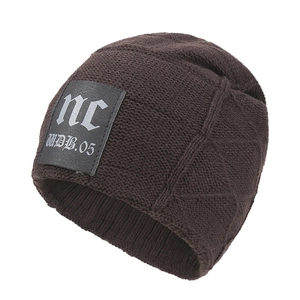 Dark brown knit beanie with leather nc patch and 3D diamond pattern for winter warmth