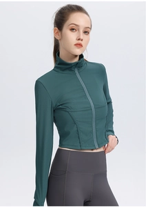 Detail of dark green ribbed yoga jacket with slim fit cut and stylish stand collar