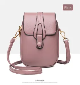 Detailed macro view of pink lychee pattern PU leather and golden metallic clasp