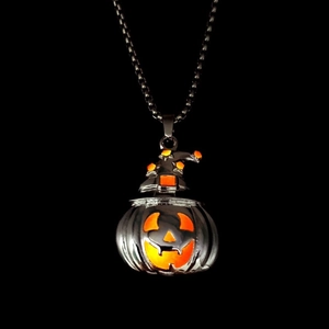 Glow-in-the-dark Halloween pumpkin pendant with wizard hat and orange fluorescent stars