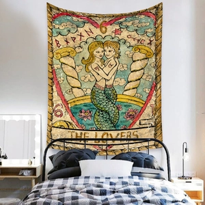 Detail of The Lovers tarot tapestry with mermaid motifs in a bohemian style bedroom