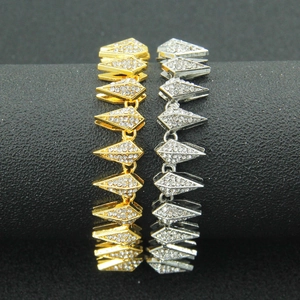 Hip hop style gold and silver iced out pyramid link chain bracelets on a black display