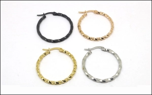 Detail view of twisted rope texture round hoop earrings in four metallic color finishes