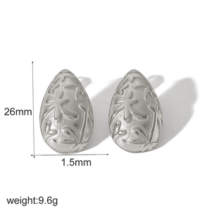 Silver teardrop earrings in stainless steel with floral relief texture and 26mm height