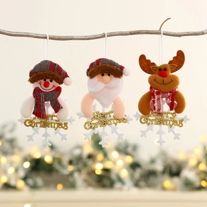 Plush Christmas ornaments set with Santa, Snowman, and Reindeer hanging on a tree