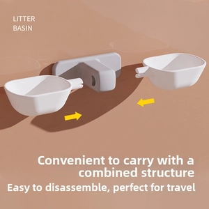 Detail view of a portable modular litter basin with detachable grey base and white plastic bowls