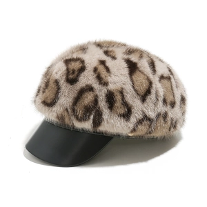 Faux mink leopard newsboy cap with black leather brim and golden hardware detail
