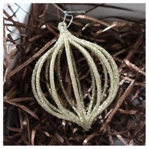 Macro shot of glittery champagne gold hollow pumpkin ball ornament for Christmas trees