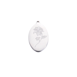 Close-up of a silver oval flower pendant with intricate birthday floral engravings
