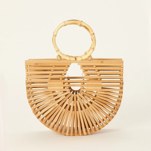 Detailed close-up of handmade semicircular bamboo handbag with circular wood handle