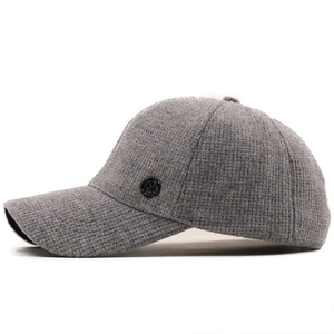 Gray knitted baseball cap with curved brim and side M logo patch for a casual winter look