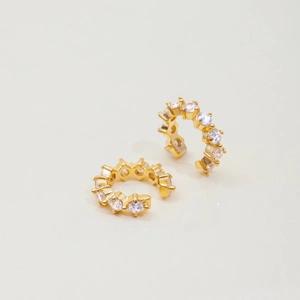 Detail of 18K gold-plated stainless steel ear cuffs with sparkling white cubic zirconia