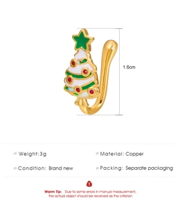 Detailed view of U-shaped Christmas tree faux nose ring with enamel and star detail