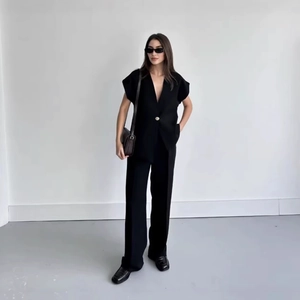 Women's chic black sleeveless vest and wide leg trousers set for elegant office wear