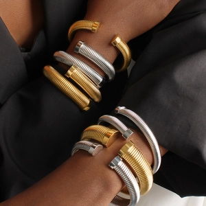 Hip hop style gold and silver threaded spring bracelets for women in stacked metal design