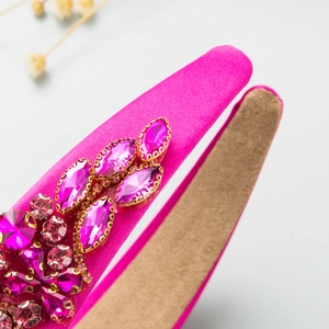 Macro detail of pink satin headband with hand-sewn marquise crystals and rhinestones