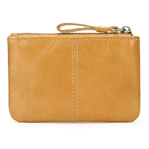Close-up of brown crazy horse leather coin purse with metal zipper and fine stitching
