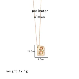 Detail of golden 18k gold plated letter B pendant with measurements 20.3x15.5mm