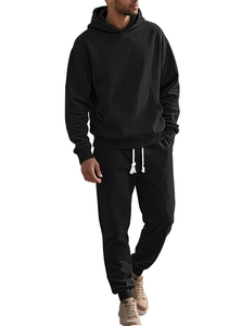 Detail of men's black waffle textured hoodie and joggers set with ribbed cuffs