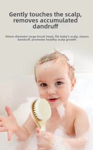Detail showing 40mm soft wool baby hairbrush with beech wood handle in a bath setting