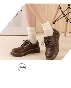 Close-up of white cotton mid-calf socks with ribbed cuffs and breathable texture