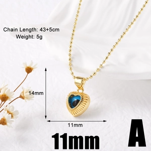 Macro shot of 18k gold plated heart evil eye pendant with measurements and chain length