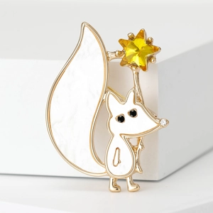 Cute white fox brooch with golden metal trim and yellow star gemstone accessory