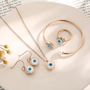 Rose gold evil eye jewelry set with shell pearl necklace earrings and open bangle