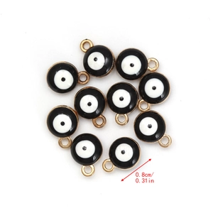 Detail view of 0.8cm black evil eye pendants with gold edges for DIY jewelry making