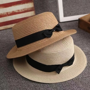 Flat top straw sun hats for women with black ribbon bow in khaki and cream colors