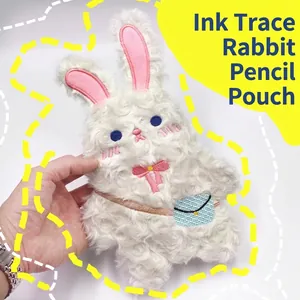 Trousse à crayons lapin en peluche blanche avec yeux bleus et nœud rose mignon