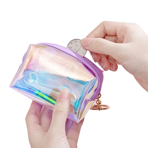 Compact holographic purple PVC coin purse with metal keychain on white background