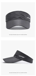 Detail of dark grey sun visor featuring breathable fabric and white sport lettering