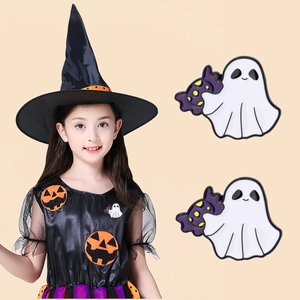 Detail of Halloween ghost enamel pins featuring a cute white ghost hugging a monster