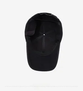Detail view of the plush lined interior and fold-down ear flaps of the black winter hat