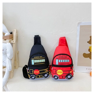 Detail view of red and black school bus shaped kids chest bags on a display stand