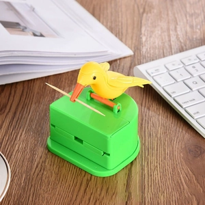 Smart green toothpick dispenser with cute yellow bird picking up a single toothpick