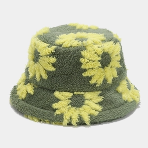 Detailed close-up of dark green plush bucket hat with vibrant yellow sunflower patterns