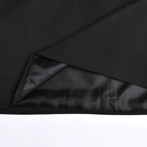 Detail view showing the high-quality black fabric stitching and smooth inner lining of the dress