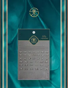 Detailed view of silver 5D bow-knot nail art stickers on premium green textured backdrop