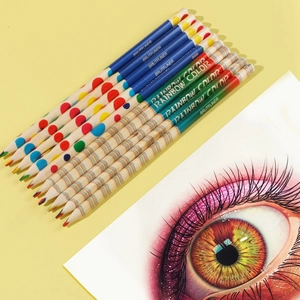 Close-up of rainbow colored core pencils with creative hand-drawn eye illustration artwork
