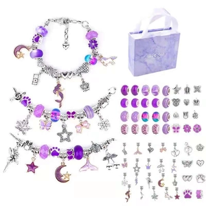 Detail view of purple DIY charm bracelet kit with beads, pendants and gift bag