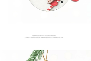 Detail of wooden snowman Christmas pendant with pine needles and rustic twine hanging element
