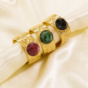 Vintage titanium steel open rings with emerald, ruby, and onyx stones on silk