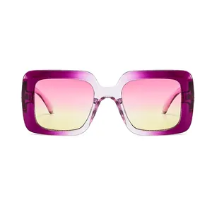 Fashionable oversized square sunglasses with purple and yellow gradient frames and lenses