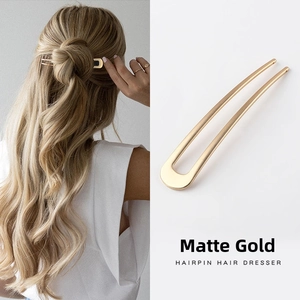 U-shaped metal hairpin in matte gold finish shown on a model and as a close-up