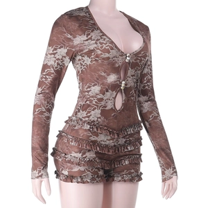Detail of floral lace bodysuit with deep V-neck, pearl buttons, and tiered ruffles