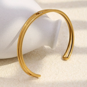 Detailed shot of double-layer gold plated stainless steel bangle with sparkling micro-diamonds