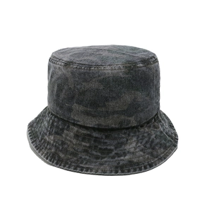 Detail of reinforced stitching on the brim of a washed denim camouflage bucket hat