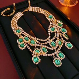 French emerald green crystal tassel necklace with gold chain and sparkling rhinestones